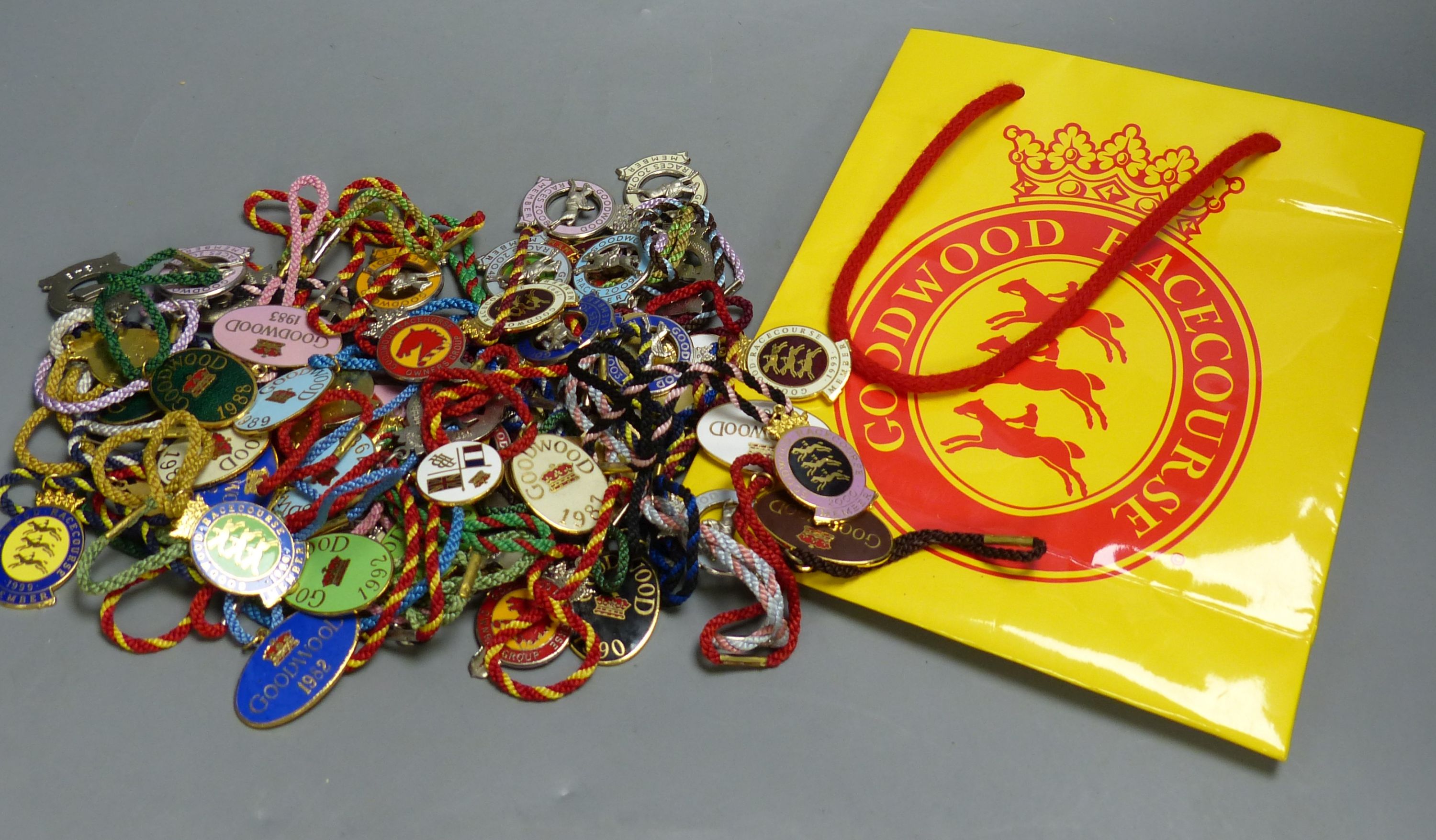 A collection of 60 Goodwood Racecourse Members enamelled badges, 1980's-2000's